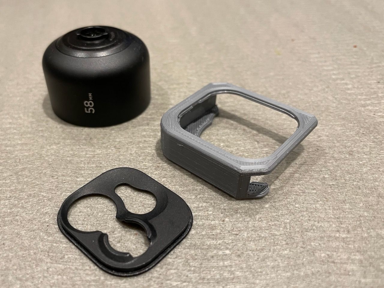 The Moment drop-in mount (black piece) was removed for this photo. It fits tightly in the grey body mount and can be left in during day-to-day use.